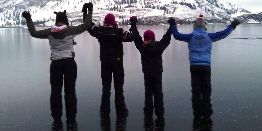 Kids playing on the frozen lake at the Lodge at Palmer Lake